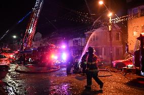 Firefighters Struggle To Put Out Fire In Three Homes On Woodside Avenue In Newark New Jersey Due To High Winds And Freezing Temp