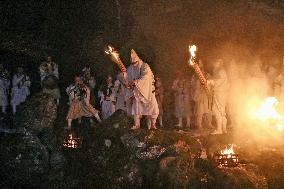 Ritual to pour holy water into river in Japan