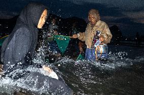 The Sasak People Gather To Catch Sea Worms Or Bau Nyale In Lombok, Indonesia.