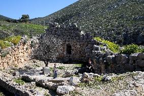 Tourists Visiting The Archaeological Site Of Mycenae.