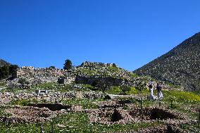 Tourists Visiting The Archaeological Site Of Mycenae.