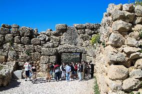 Tourists Visiting The Archaeological Site Of Mycenae.