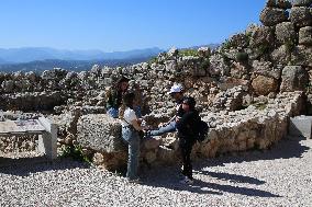 Tourists Visiting The Archaeological Site Of Mycenae.