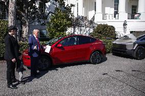 DC: President Trump views Tesla vehilces in Front of The White House