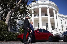 DC: President Trump views Tesla vehilces in Front of The White House