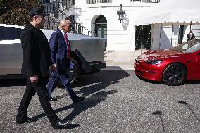 DC: President Trump views Tesla vehicles in Front of The White House