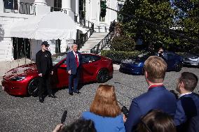 DC: President Trump views Tesla vehicles in Front of The White House