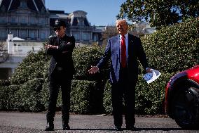 DC: President Trump views Tesla vehicles in Front of The White House
