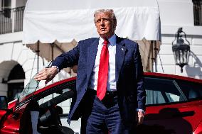 DC: President Trump views Tesla vehicles in Front of The White House