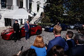 DC: President Trump views Tesla vehicles in Front of The White House