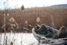 Soldiers of 40th Separate Coastal Defense Brigade practice landing from motorboats