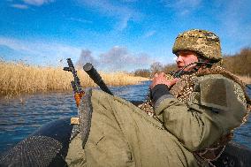 Soldiers of 40th Separate Coastal Defense Brigade practice landing from motorboats