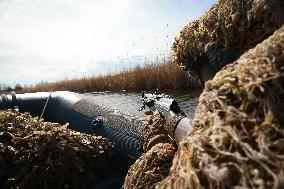 Soldiers of 40th Separate Coastal Defense Brigade practice landing from motorboats