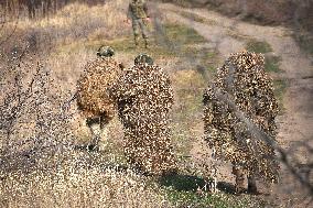 Soldiers of 40th Separate Coastal Defense Brigade practice landing from motorboats