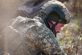 Soldiers of 40th Separate Coastal Defense Brigade practice landing from motorboats