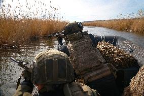 Soldiers of 40th Separate Coastal Defense Brigade practice landing from motorboats