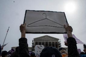 Protestors rally in support of Planned Parenthood, in front of the Supreme Court