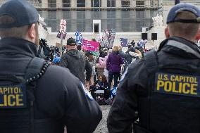 Protestors rally in support of Planned Parenthood, in front of the Supreme Court