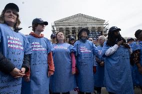 Protestors rally in support of Planned Parenthood, in front of the Supreme Court