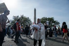 Pro-Palestinian protestors march from the National Gallery to ICE Headquarters in Washington, DC, on Saturday April 5, 2025. Thi
