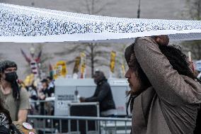 Pro-Palestinian protestors march from the National Gallery to ICE Headquarters in Washington, DC, on Saturday April 5, 2025. Thi