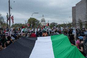 Pro-Palestinian protestors march from the National Gallery to ICE Headquarters in Washington, DC, on Saturday April 5, 2025. Thi