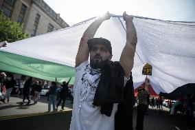 Pro-Palestinian protestors march from the National Gallery to ICE Headquarters in Washington, DC, on Saturday April 5, 2025. Thi