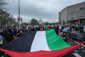Pro-Palestinian protestors march from the National Gallery to ICE Headquarters in Washington, DC, on Saturday April 5, 2025. Thi