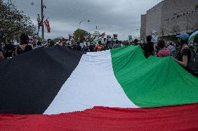 Pro-Palestinian protestors march from the National Gallery to ICE Headquarters in Washington, DC, on Saturday April 5, 2025. Thi