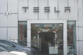 Tesla Shares Fall As Tariffs Hit