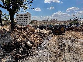 Bulldozer Clears Aleppo Road Under New Agreement