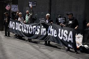 Protesters Demonstrate Outside Elite Law Firm Over Deal With Trump
