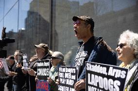 Protesters Demonstrate Outside Elite Law Firm Over Deal With Trump