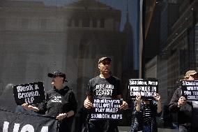 Protesters Demonstrate Outside Elite Law Firm Over Deal With Trump
