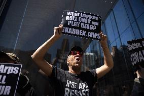 Protesters Demonstrate Outside Elite Law Firm Over Deal With Trump