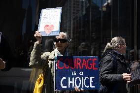 Protesters Demonstrate Outside Elite Law Firm Over Deal With Trump