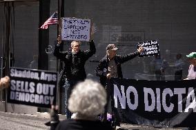 Protesters Demonstrate Outside Elite Law Firm Over Deal With Trump