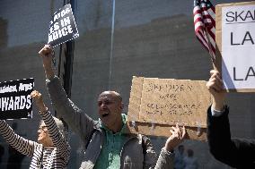 Protesters Demonstrate Outside Elite Law Firm Over Deal With Trump