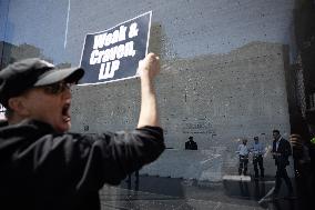 Protesters Demonstrate Outside Elite Law Firm Over Deal With Trump