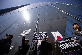 Protesters Demonstrate Outside Elite Law Firm Over Deal With Trump