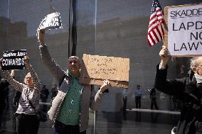 Protesters Demonstrate Outside Elite Law Firm Over Deal With Trump