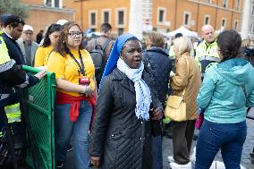 People queue at St Peter Basilica to pay their respects to late Pope Francis - Rome