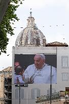 People queue at St Peter Basilica to pay their respects to late Pope Francis - Rome