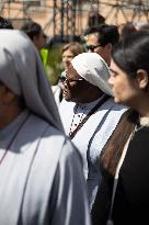 People queue at St Peter Basilica to pay their respects to late Pope Francis - Rome