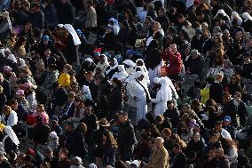 The faithful and priests wait on the steps of St Peter s Basilica for the Funeral of Pope Francis