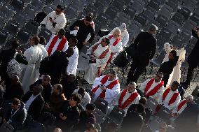 The faithful and priests wait on the steps of St Peter s Basilica for the Funeral of Pope Francis