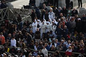 The faithful and priests wait on the steps of St Peter s Basilica for the Funeral of Pope Francis