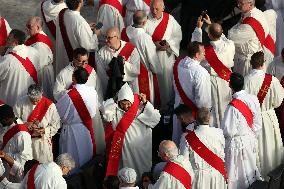 The faithful and priests wait on the steps of St Peter s Basilica for the Funeral of Pope Francis