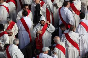 The faithful and priests wait on the steps of St Peter s Basilica for the Funeral of Pope Francis