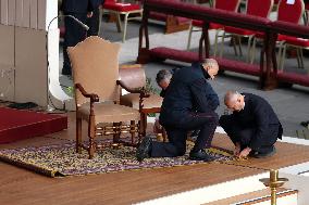 The faithful and priests wait on the steps of St Peter s Basilica for the Funeral of Pope Francis